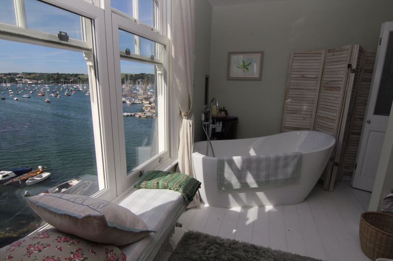 Bedroom with bath and view